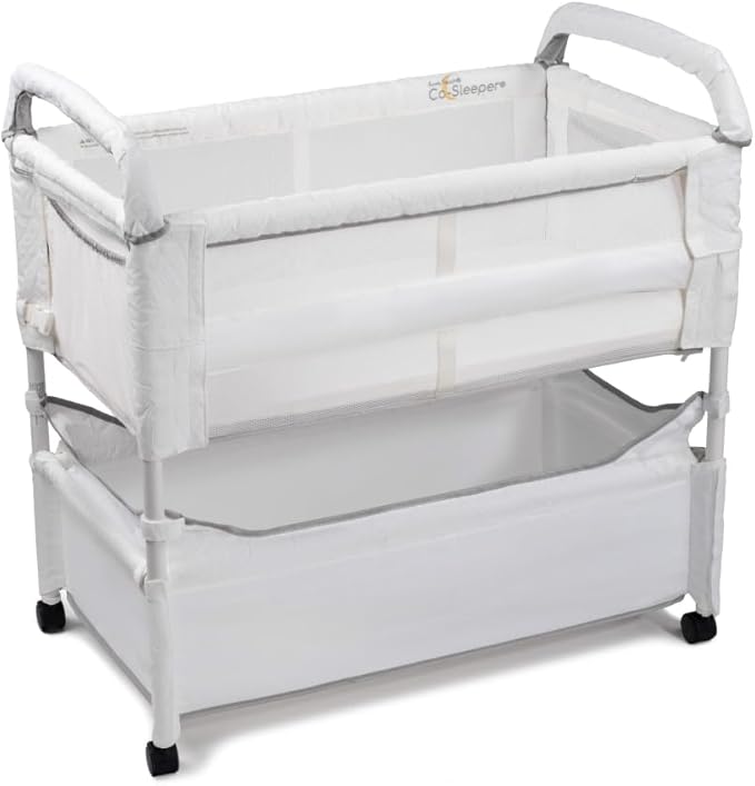 Arm’s Reach Clear-Vue Co-Sleeper Bedside Bassinet Featuring Clear Mesh Panels with Fold-Down Side, Large Attached Storage Basket, 4 Wheels, and Height-Adjustable Legs, White