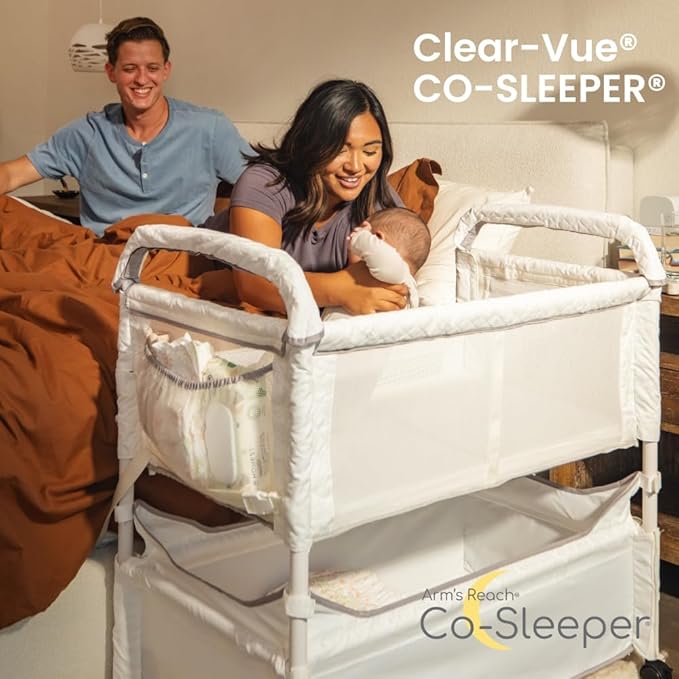 Arm’s Reach Clear-Vue Co-Sleeper Bedside Bassinet Featuring Clear Mesh Panels with Fold-Down Side, Large Attached Storage Basket, 4 Wheels, and Height-Adjustable Legs, White