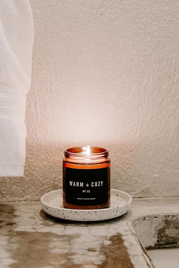 Sweet Water Decor Warm and Cozy Candle | Pine, Orange, Cinnamon, and Fir Balsam Winter Scented Soy Candles for Home | 9oz Amber Jar with Black Lid, 40 Hour Burn Time, Made in The USA